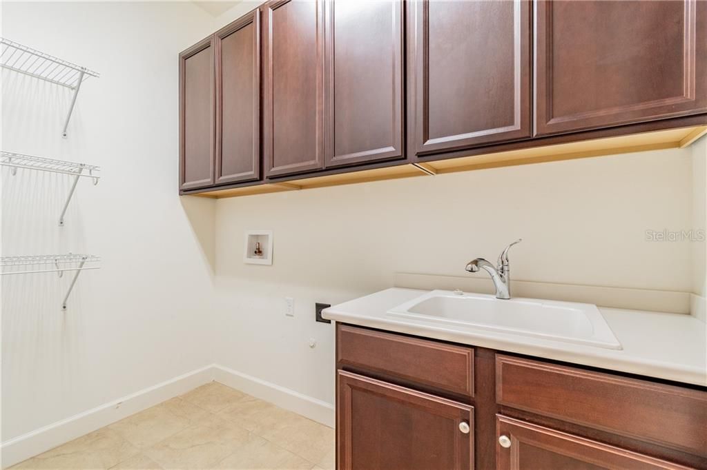 Laundry Room with Cabinets and Sink