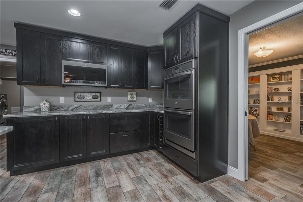 Completely Remodeled Kitchen. New KraftMaid Cabinetry - Solid Wood Kitchen Cabinets, Quartzite Kitchen Countertops, New GE Profile Series Energy Star Appliances. 30??? Built-In Double Wall Oven and Built-In Space Saver Microwave.