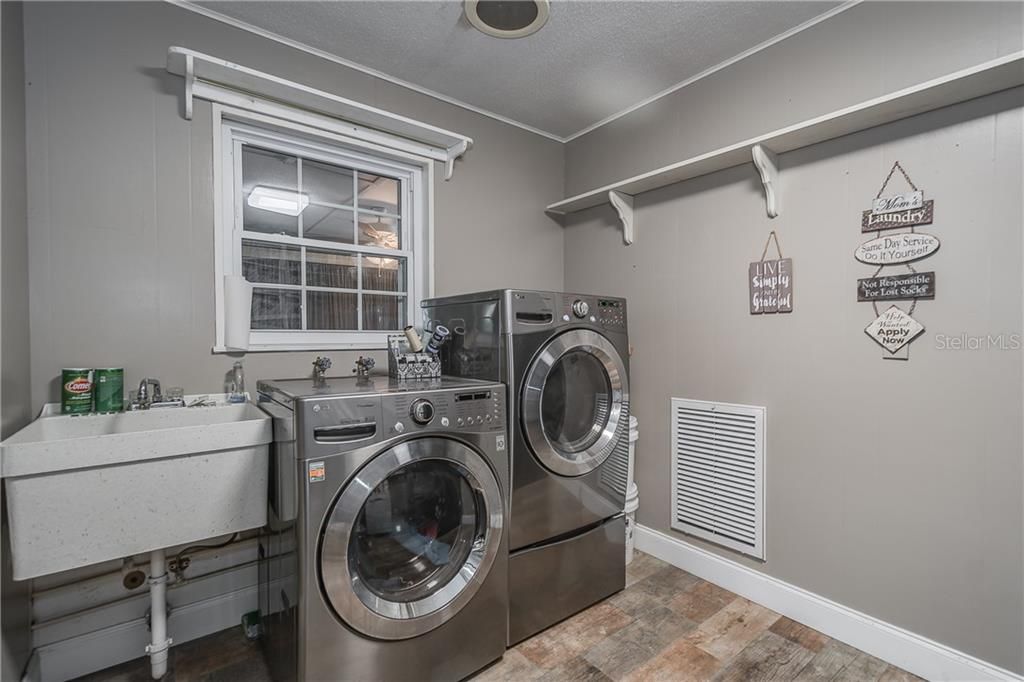 Indoor Laundry room. House Completely Replumbed (2016). Tankless Water Heater.