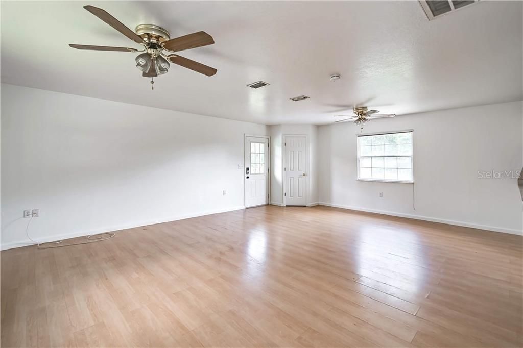 One bedroom and one bathroom room over the garage apartment. Living room with closet near the front door.