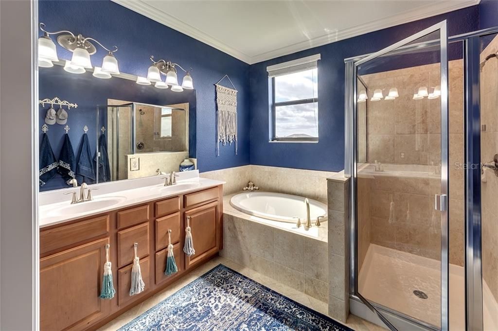 En-Suite Bath with Double Sink Vanity, Soaking Tub, and Walk-In Shower