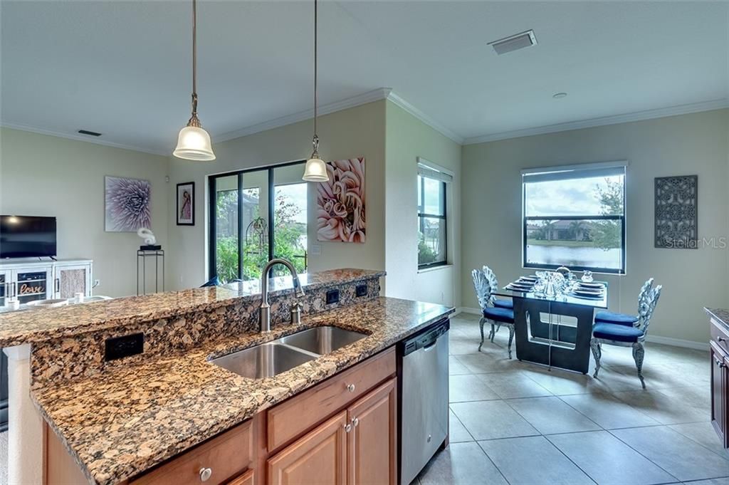 Expansive Gourmet Kitchen Overlooks the Great Room with Sliding Patio Doors to Breathtaking Views