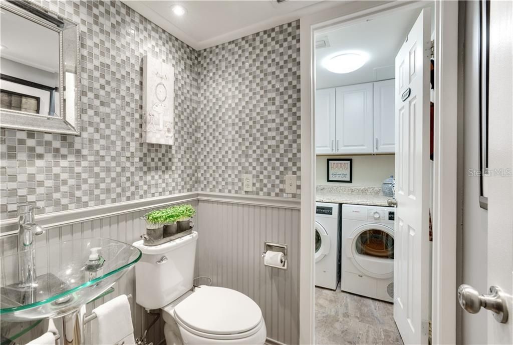 GUEST BATHROOM LEADING TO LAUNDRY ROOM