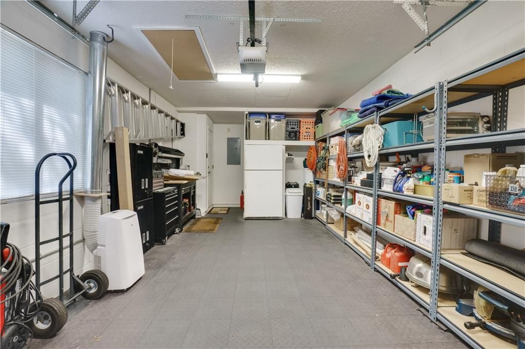 ONE CAR GARAGE WITH ATTIC ACCESS AND EXTRA REFRIGERATOR