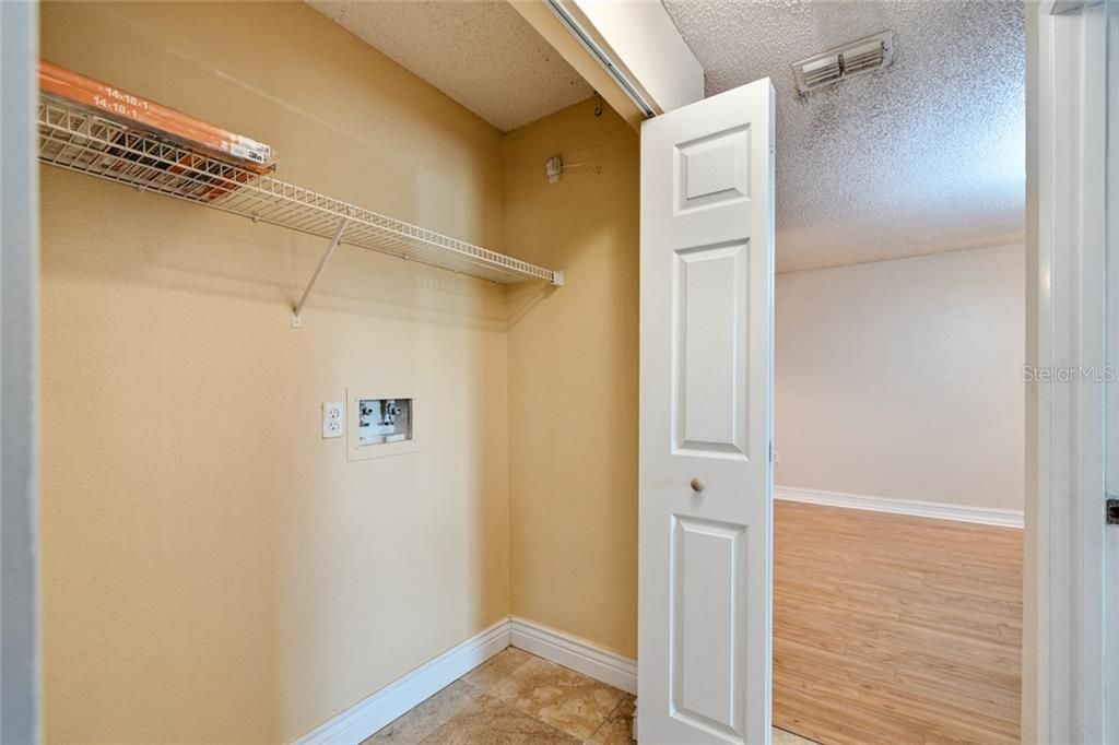 Laundry closet is inside the condo and will hold full size washer and dryer