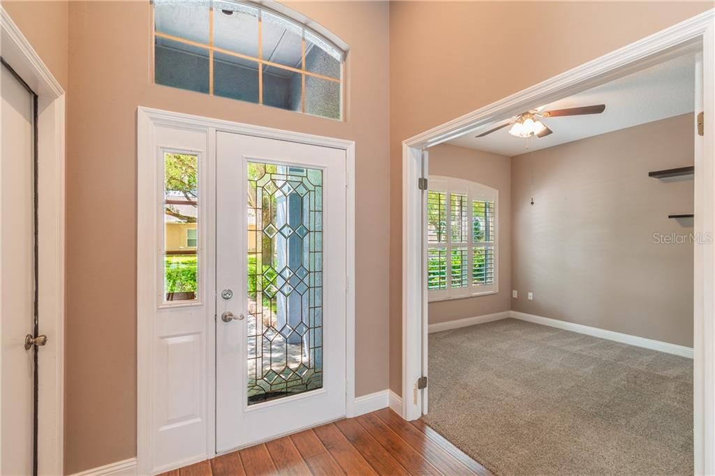 beautiful doorway welcomes you to this home, office to the right