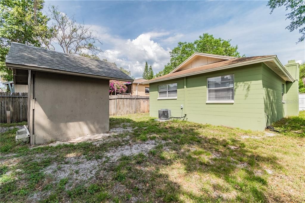 9606 N. Hartts Drive, Tampa, FL 33617  - View of backyard. Shed include with sale.