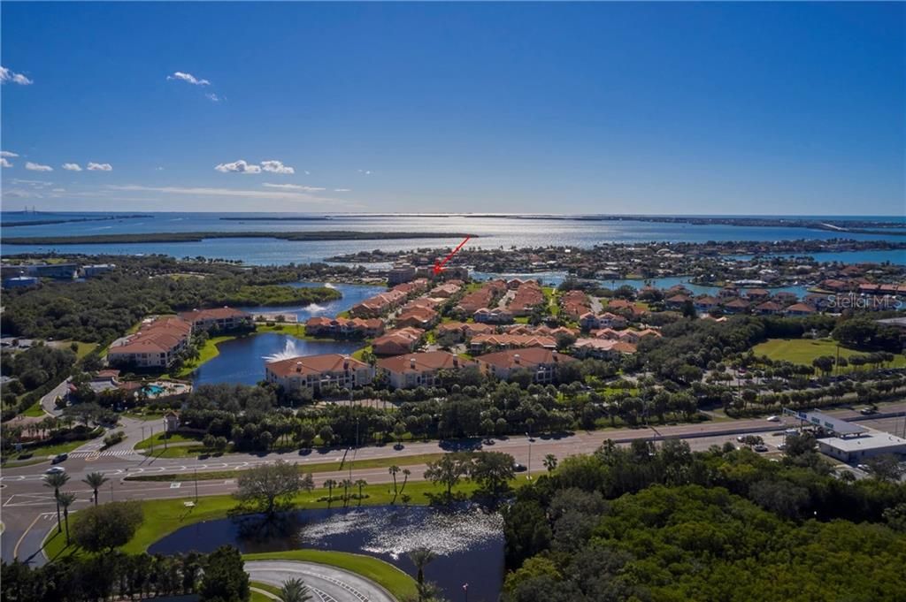 Marina Bay aerial, with arrow to location of 44B Bayview Court, community features almost 60-acres on Boca Ciega Bay, just 6 minutes to downtown St. Petersburg, even less to St. Pete Beach and the Skyway Bridge to Sarasota.