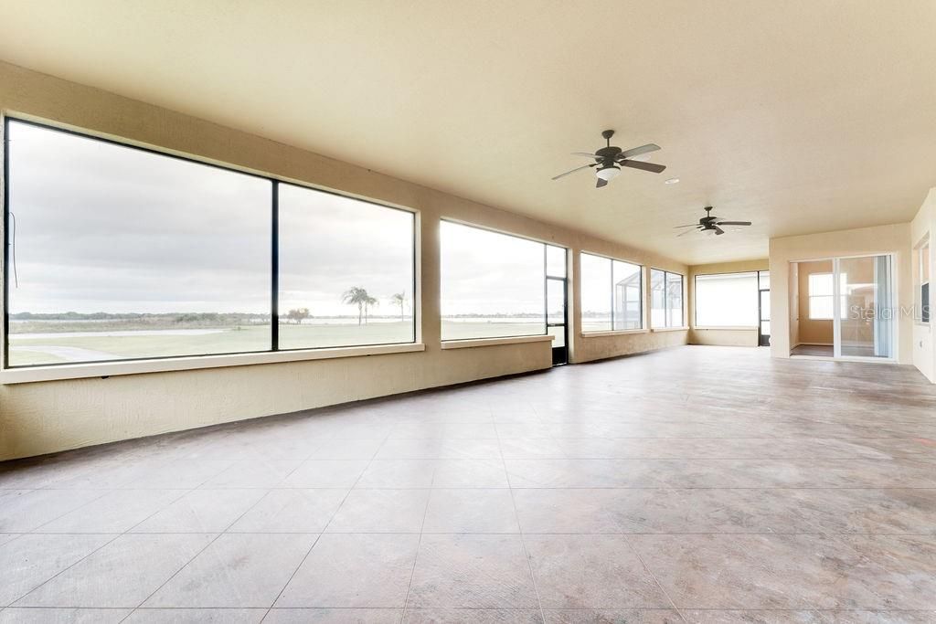 1200 sf screened, covered and insulated lanai with view of golf course, pond and Lake Ashton.