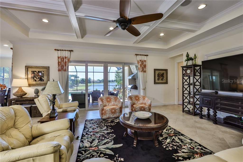 Coffered ceiling, tile on the diagonal and crown molding are just a few of the upgrades in this home.