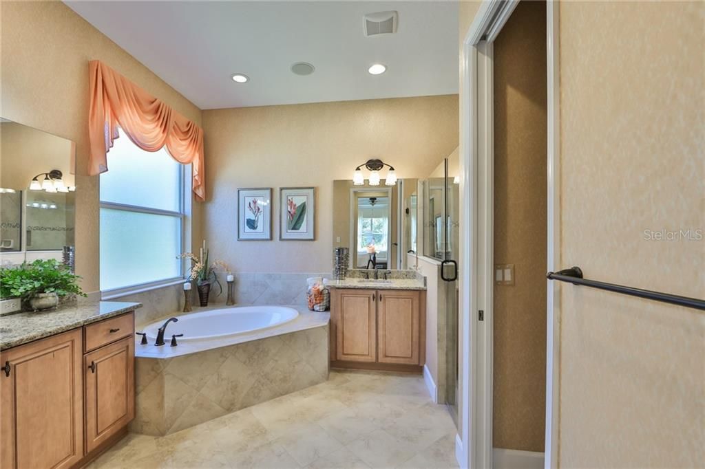 Master bath with two separate sinks, granite counters and the shower even has a 'rain head' in it.