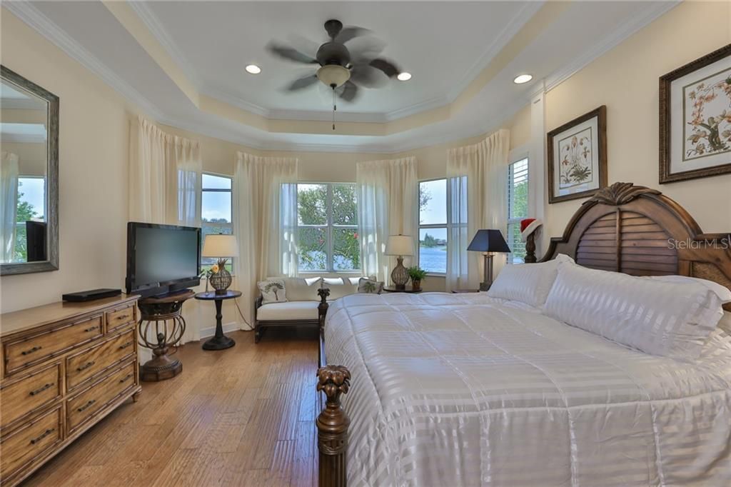 Master bedroom is spacious, with exquisite hardwood engineered flooring and large windows to enjoy the water view.