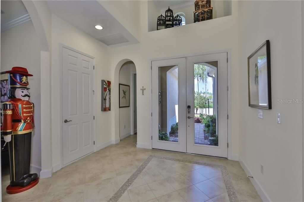 The foyer entrance is large and grand with special tile work accentuating the area.