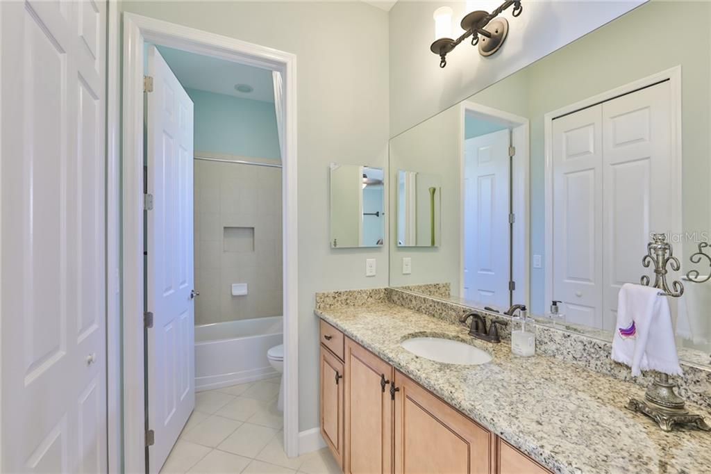 Ensuite bathroom is lovely with a large closet and smart finishes.