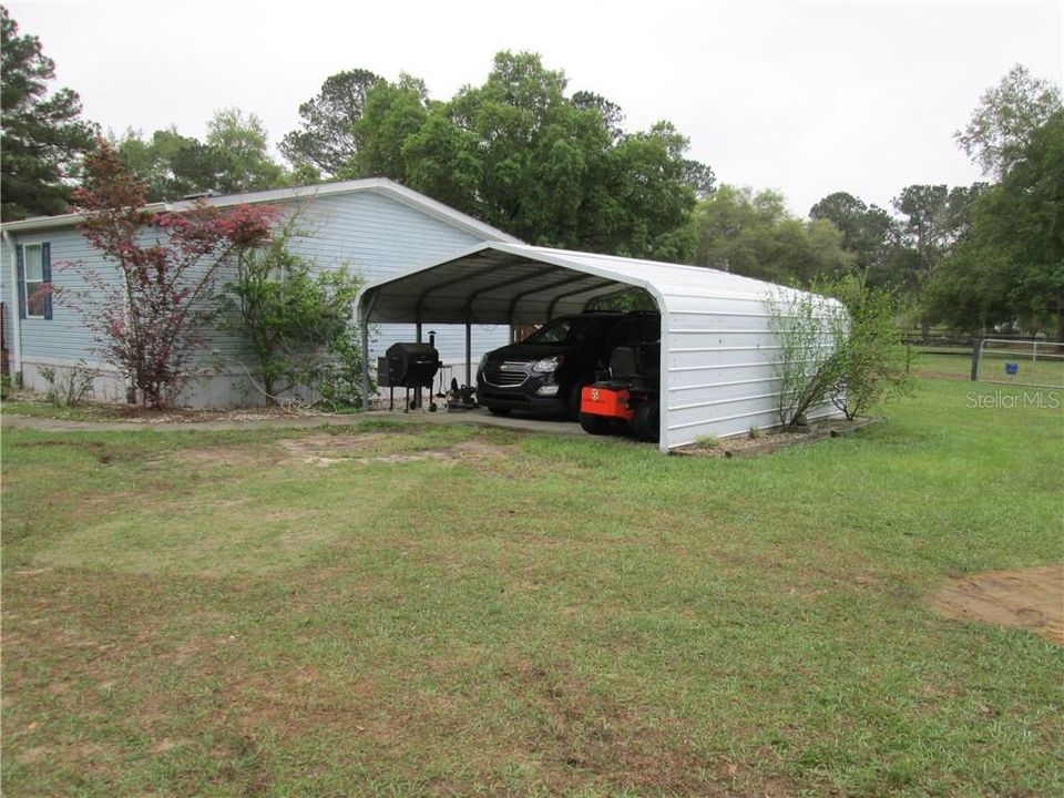 West side of home with carport