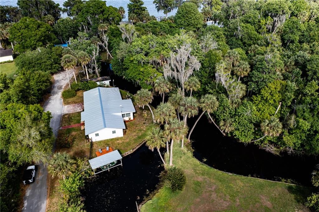 Brand New Metal Roof, Brand New Party Pad, Dock, and Canals leading to Lake Pierce