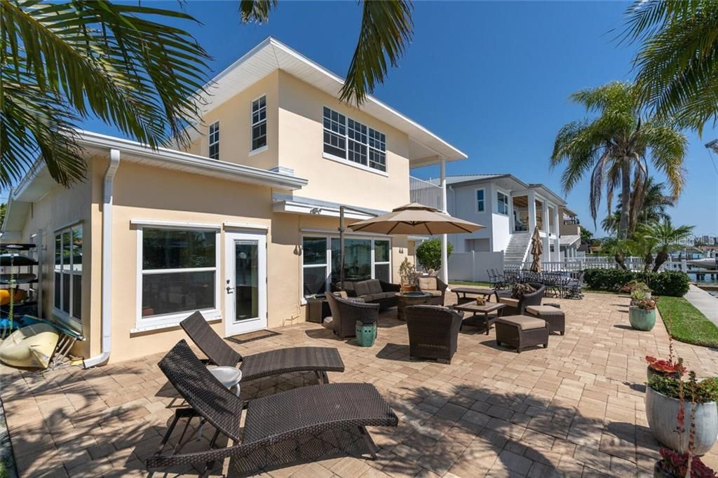 Spacious Backyard with Pavers offering spectacular westerly water views