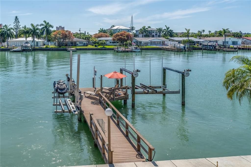 Newer Dock with Evergrain composite decking, lower landing, ladder, water, electric, 16K lb boat lift, and 2 "swinger" PWC boat lifts - all with remotes