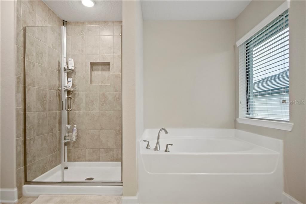 Master bath with separate shower and garden tub.