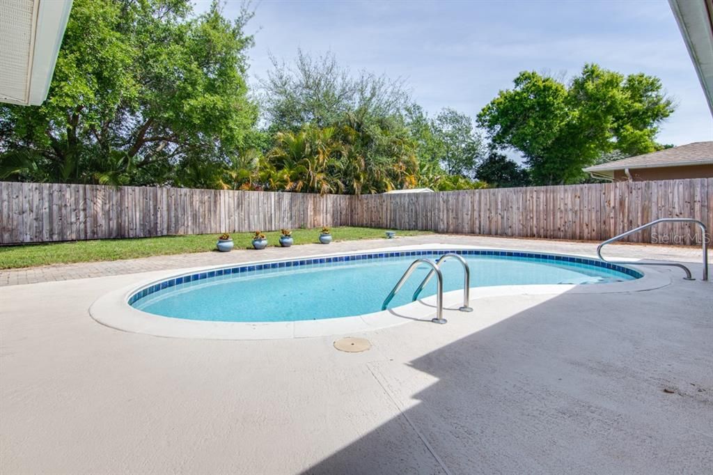 recently resurfaced 15,000 gallon swimming pool, fenced yard