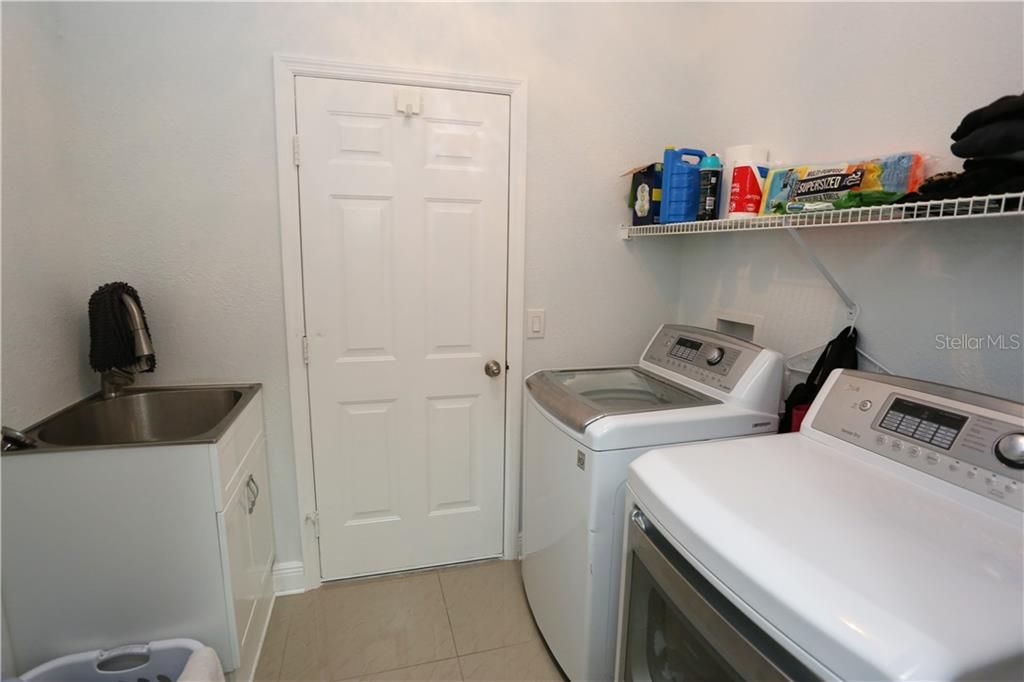 Laundry room with door to garage