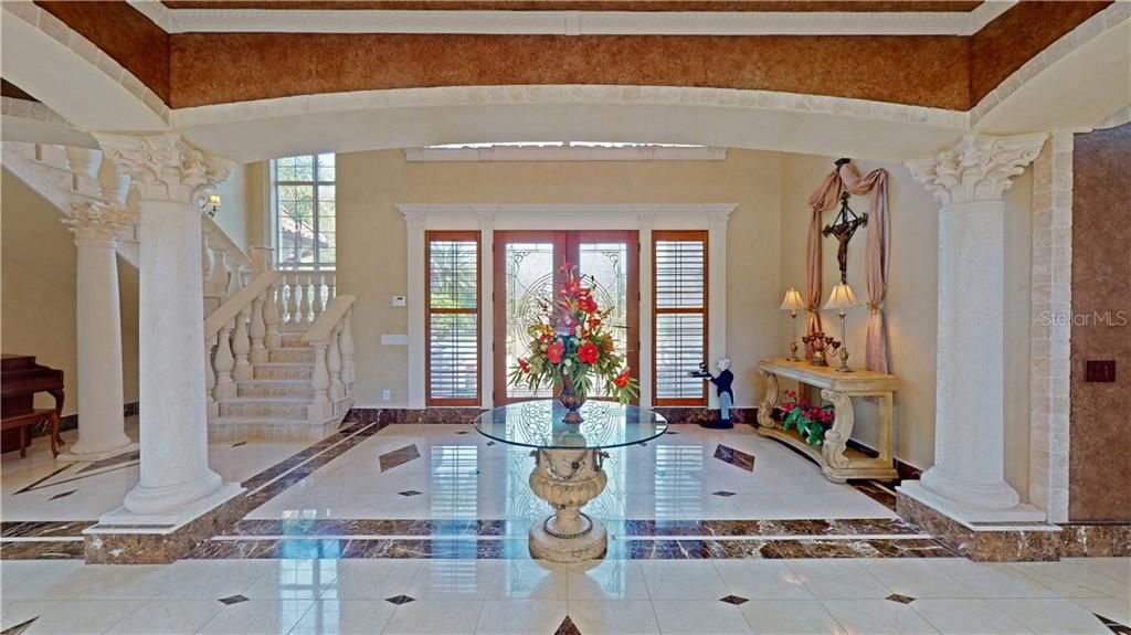 Gorgeous marble flooring throughout the front foyer.