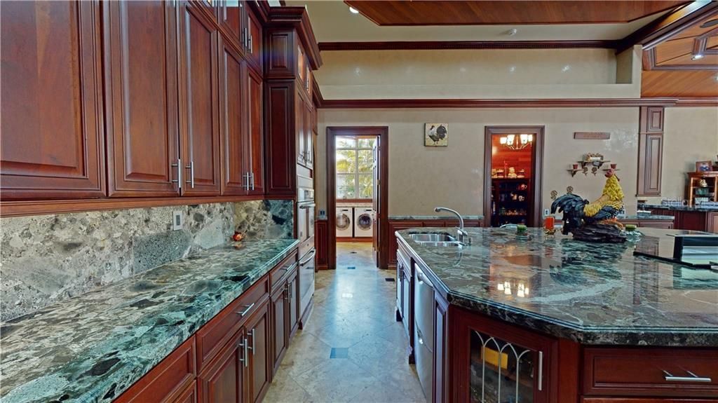 Solid wood cabinetry with full stone backsplash.