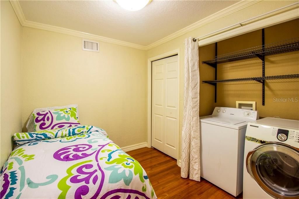 Guest house #2 bedroom with laundry facilities.