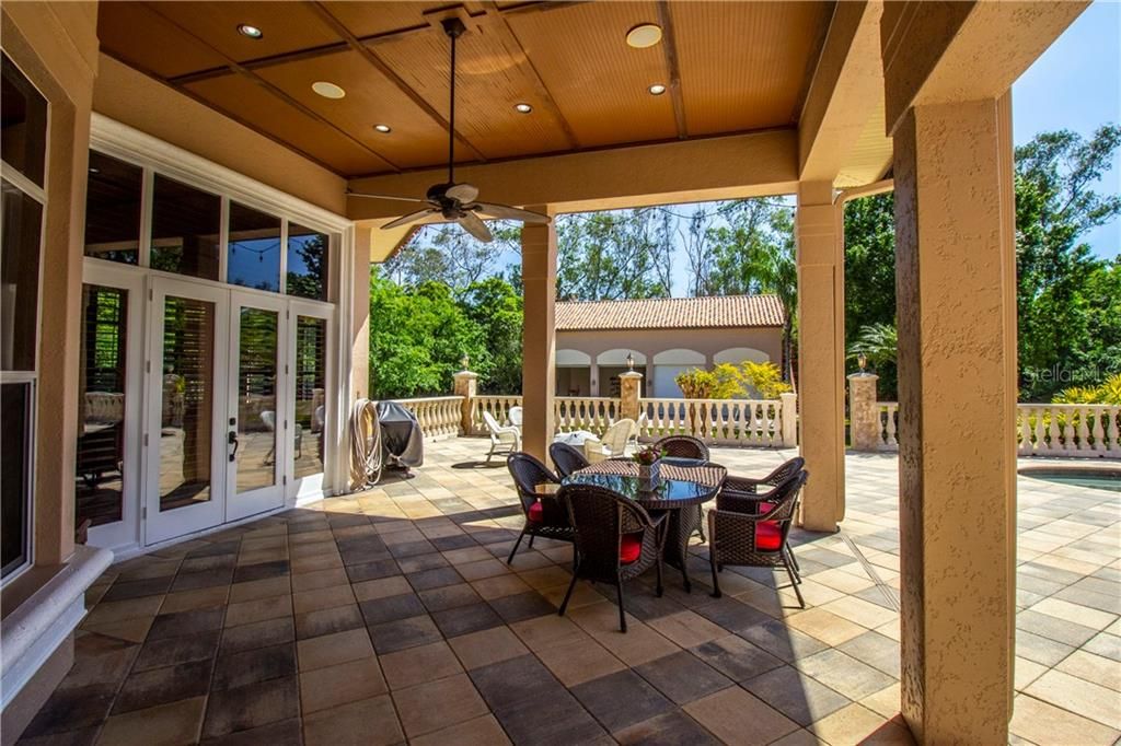 Spacious covered lanai with french doors from the family room.
