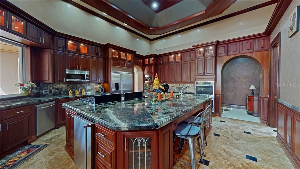 Exotic marble countertops throughout the kitchen.