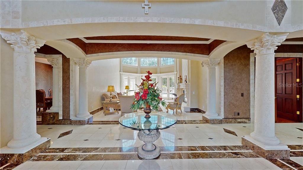 Graceful arches and columns were designed for the foyer entry.