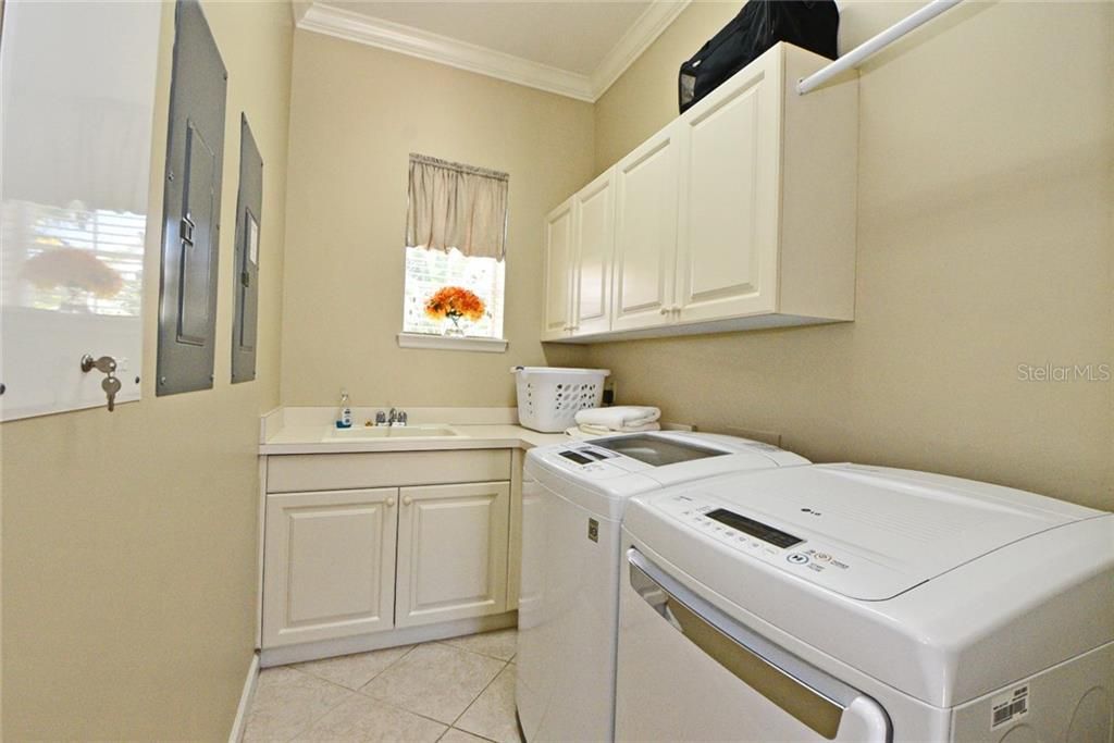 Laundry with Sink and Storage Cabinets