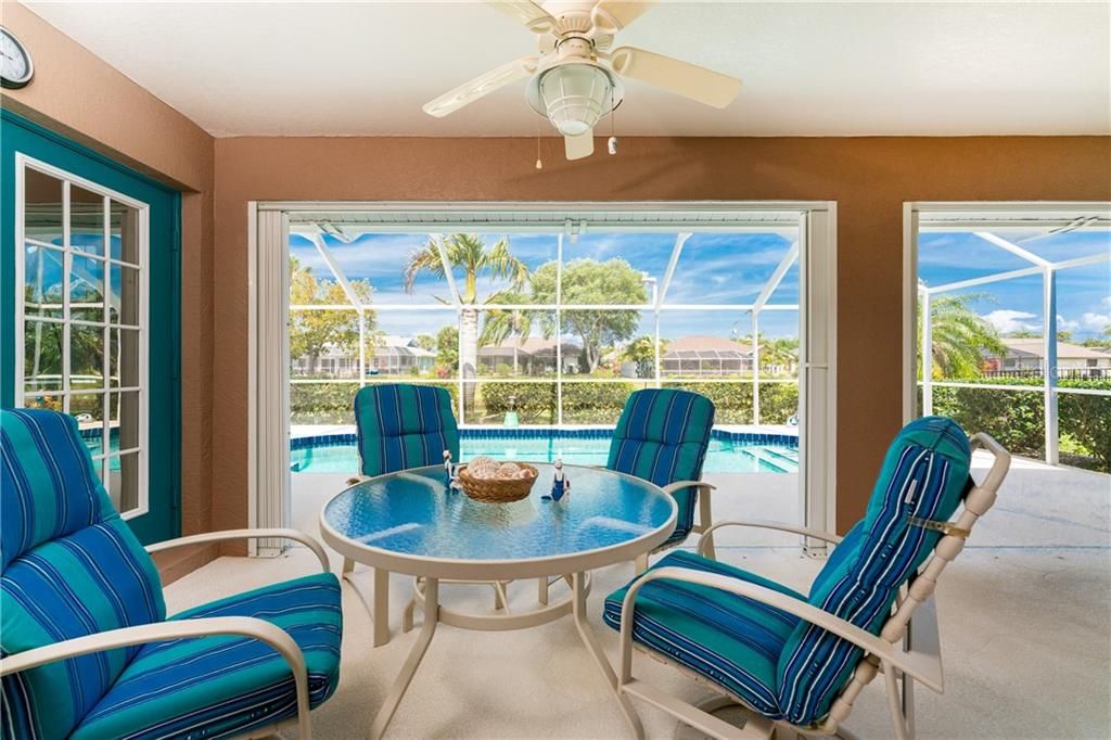 The fabulous lanai is the natural gathering place in the home--many happy memories have been made right here.  Just beyond is a heated pool with a tranquil canal as the backdrop.  It's a tropical oasis right in your own back yard.