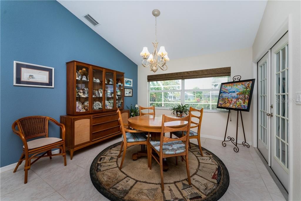 The dinette is found adjacent to the kitchen and offers easy access to the lanai through French doors.