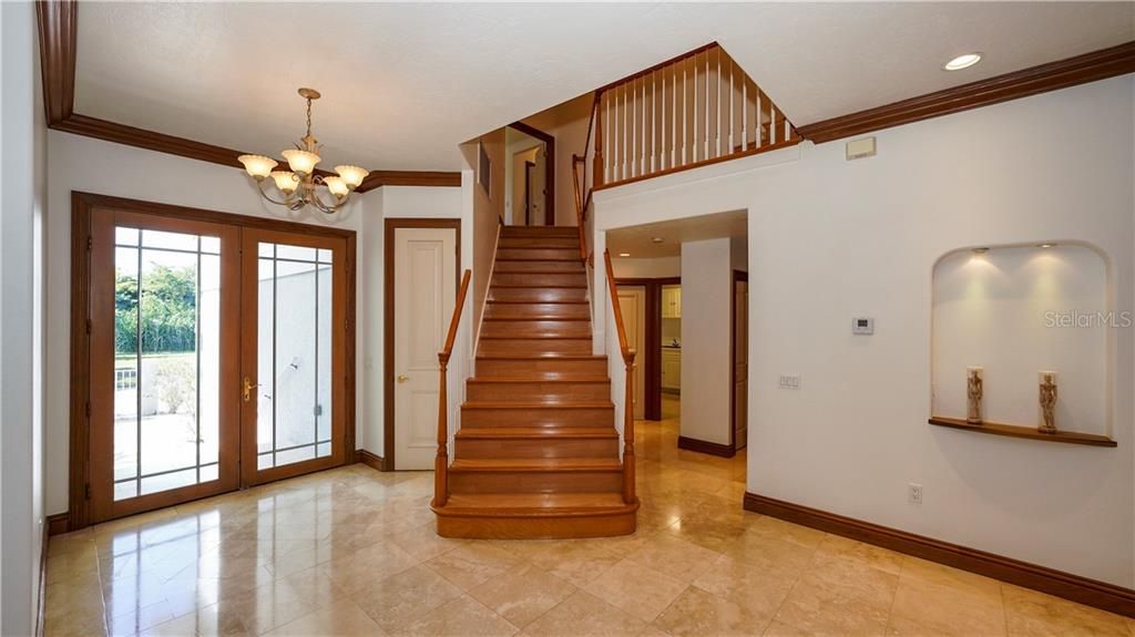 Foyer with stairs toward 2nd floor Master Suite and large bonus room.
