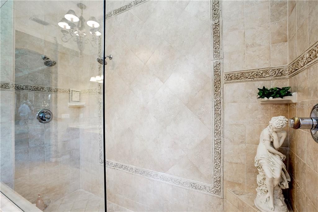 Large shower with new glass enclosure.