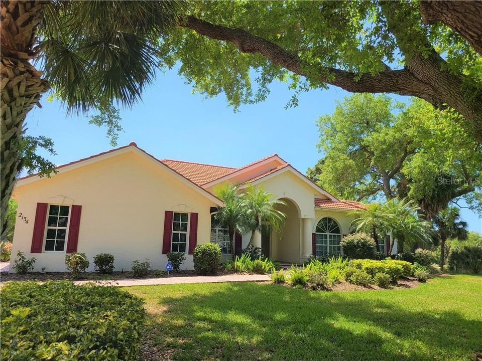 Nicely landscaped with lake to the right of this property