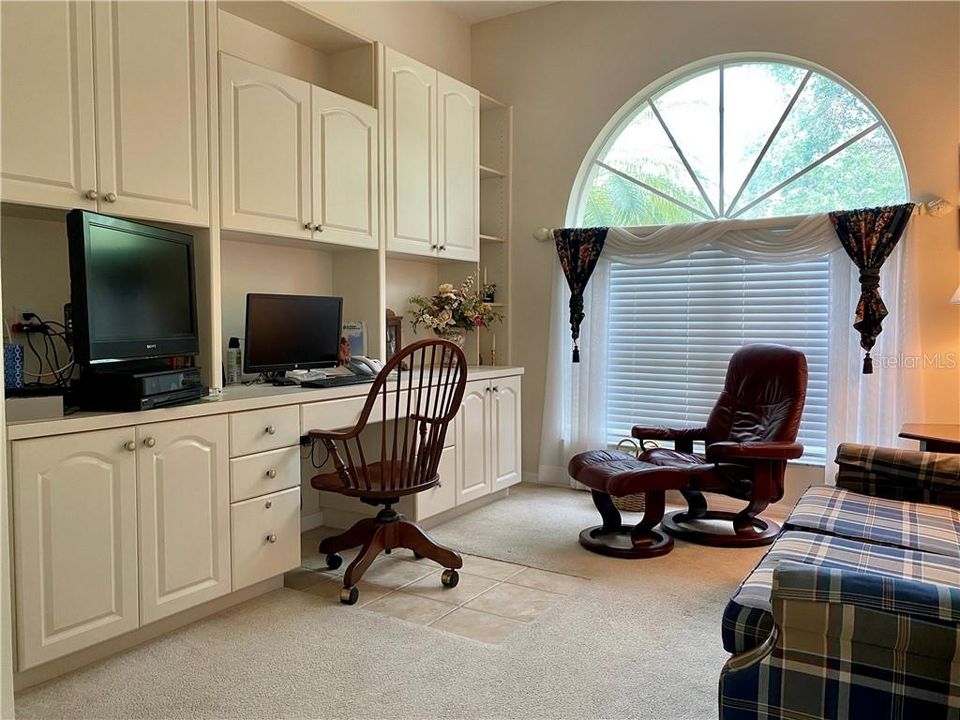 Study/den with built in shelving.  This room has many options and does have a closet as well.  French door entry