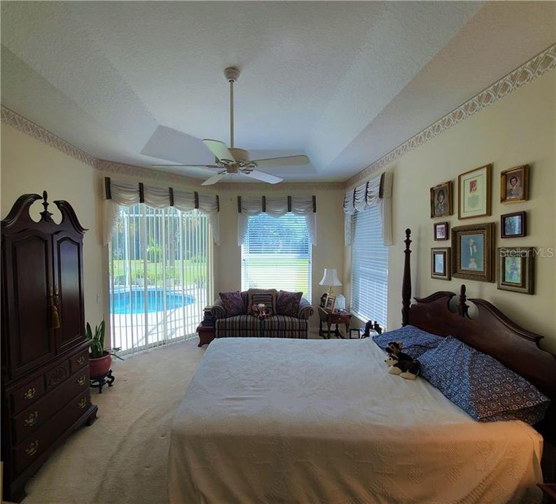 Master Bedroom with patio doors to patio/pool.  Very private setting!