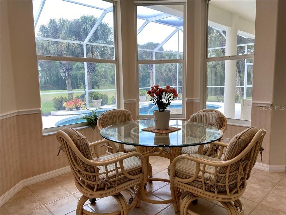 Relax in the dinette area just off the kitchen overlooking the peaceful backyard