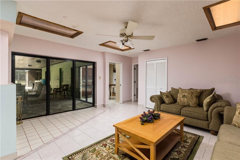 Enter the In-law suite from the kitchen, sliders to the pool and 3rd fireplace!