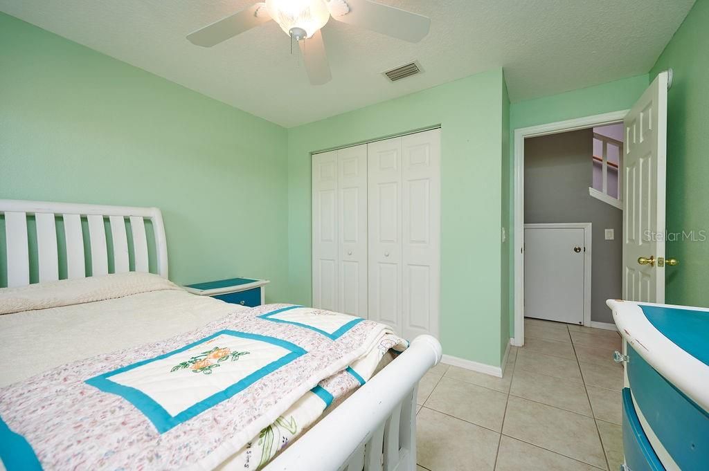 This guest bedroom is just outside of the guest bath and staircase