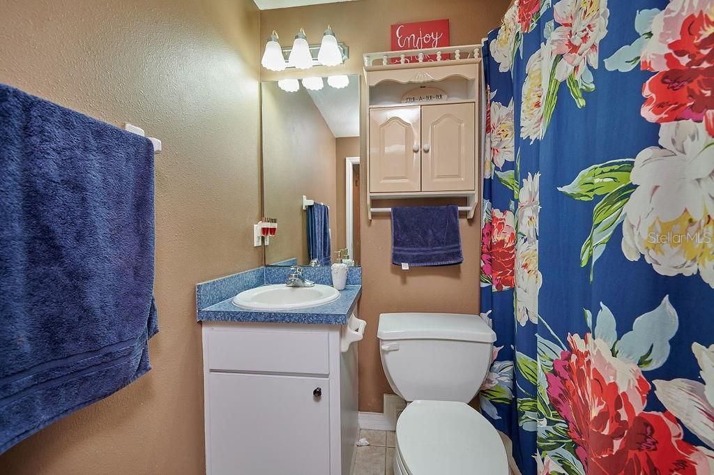 Downstairs guest bathroom offers a tub/shower combination