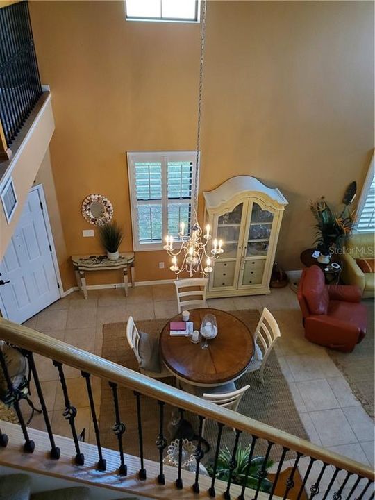 VIEW FROM 2ND FLOOR HALL OVERLOOKS 2 STORY LIVING AREA.  PLANTATION SHUTTERS THROUGHOUT.