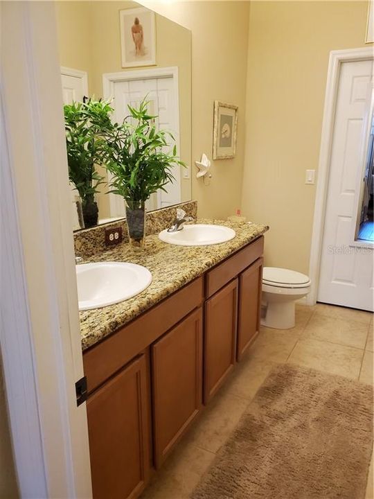 DOUBLE SINK VANITY IN MASTER BATH.  WALK IN CLOSET IS AT END.  LINEN CLOSET ACROSS FROM TOILET.