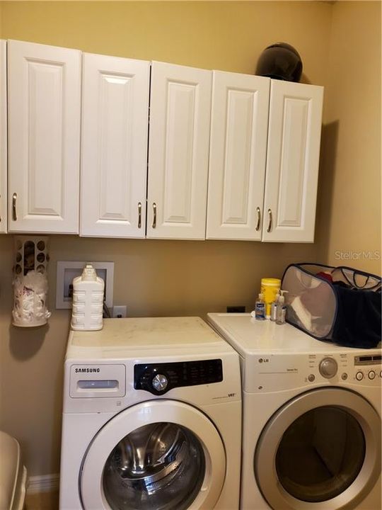 INSIDE LAUNDRY WITH FRONT LOADING WASHER/DRYER.  A UTILITY SINK COULD BE INSTALLED.  WATER SOFTENER IS IN GARAGE