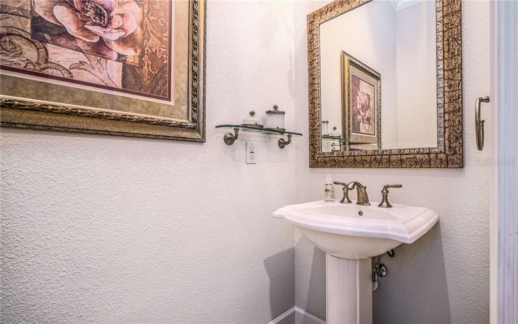 This half bath is just off the kitchen and laundry room!