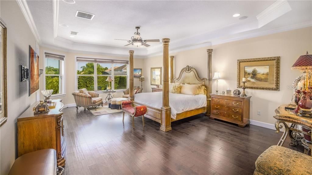 Stunning Master bedroom with views of the pool and the lake...