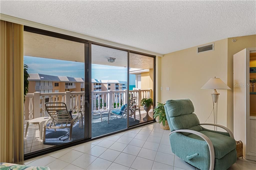 Room for a game table or recliners in the great room with blue water views!