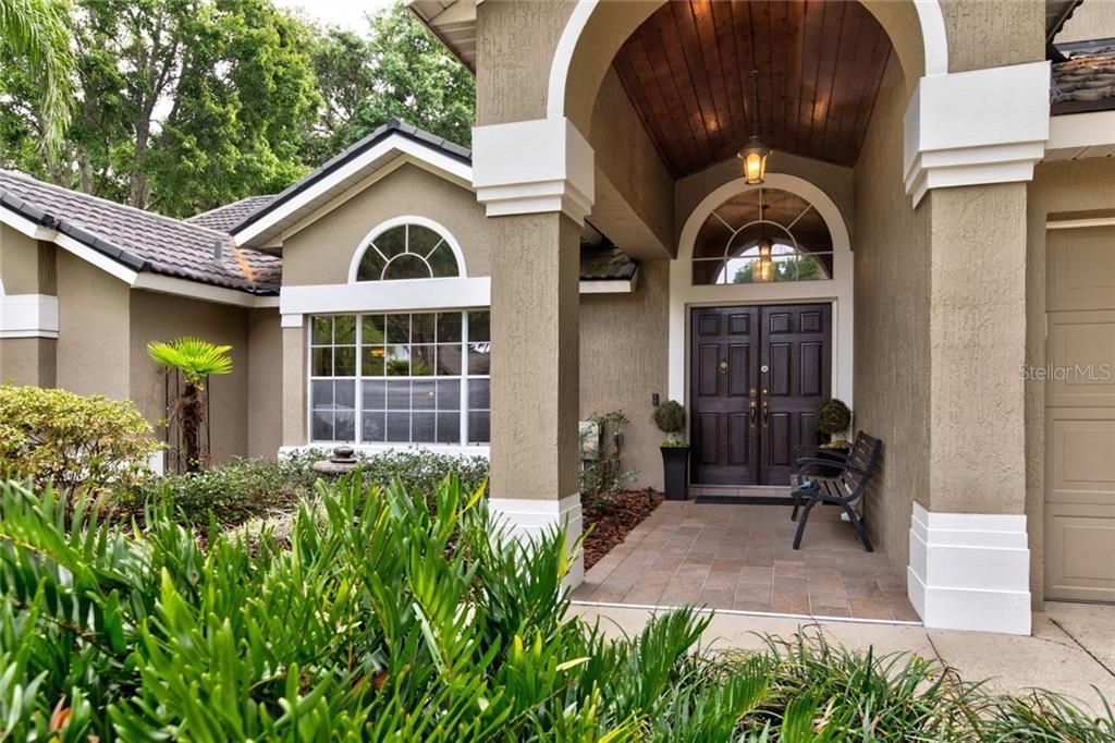 Arched Entry with Wood Accents